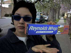 Woman offering REYNOLDS WRAP